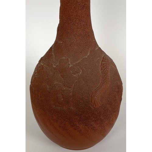 863 - A Chinese pottery bottle vase, decorated a dragon, character mark to base, 28 cm high