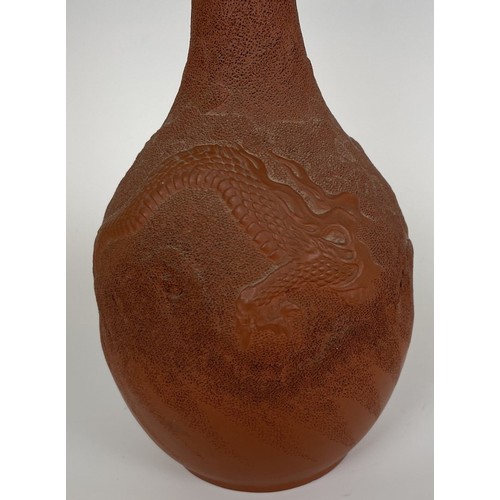 863 - A Chinese pottery bottle vase, decorated a dragon, character mark to base, 28 cm high