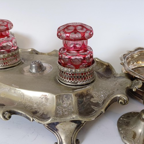 1 - A Victorian silver plated desk stand, with cased glass inkwells, a pair of bottle coasters and assor... 