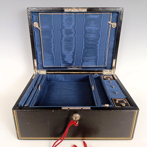 2 - A late Victorian leather travelling box, with various compartments, unusually with silver mounts, in... 