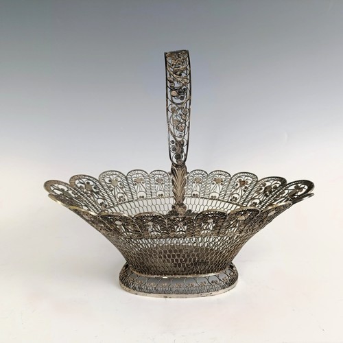 9 - A silver coloured metal filigree basket, 29 cm wide...