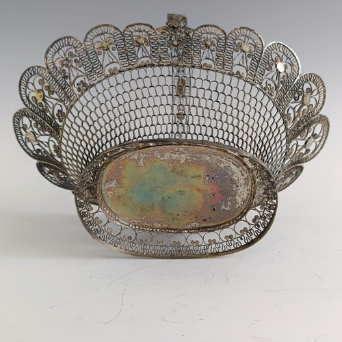 9 - A silver coloured metal filigree basket, 29 cm wide...