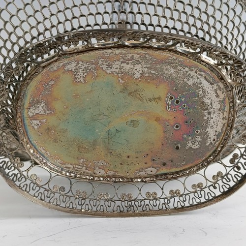 9 - A silver coloured metal filigree basket, 29 cm wide...