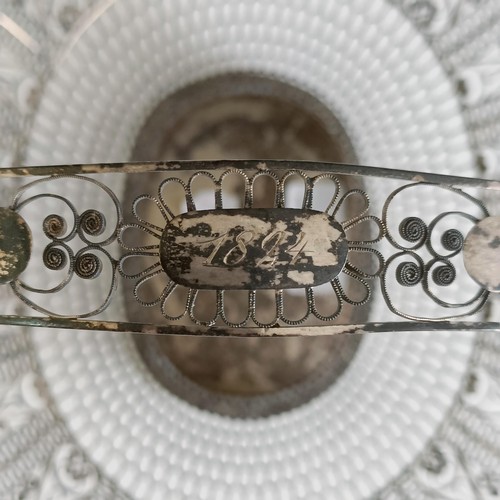 9 - A silver coloured metal filigree basket, 29 cm wide...