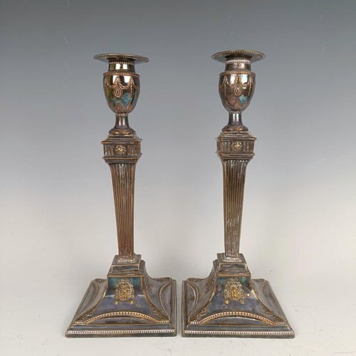 24 - A pair of late 18th century style plated on copper candelsticks (2)...