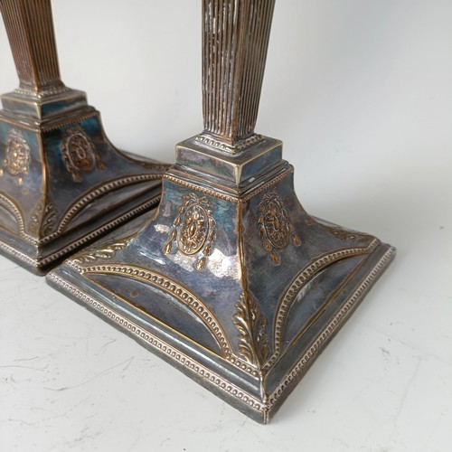 24 - A pair of late 18th century style plated on copper candelsticks (2)...