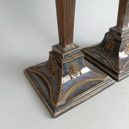 24 - A pair of late 18th century style plated on copper candelsticks (2)...