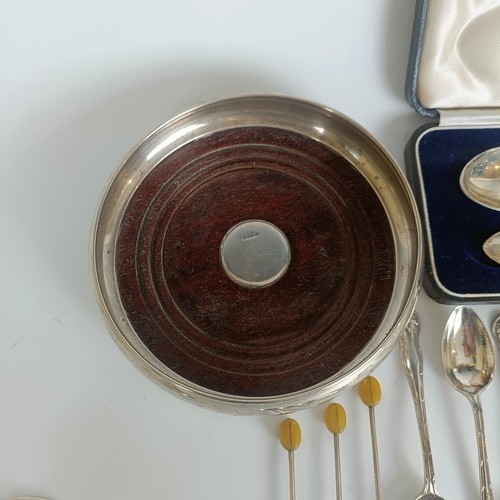 98 - A silver christening spoon and fork set, initialled, Sheffield 1935, cased, a silver jug, and other ... 