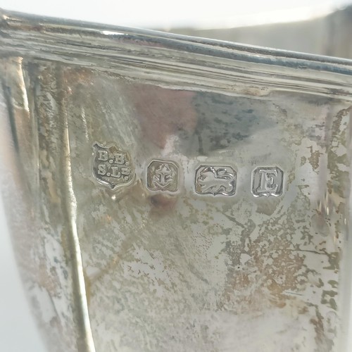 98 - A silver christening spoon and fork set, initialled, Sheffield 1935, cased, a silver jug, and other ... 