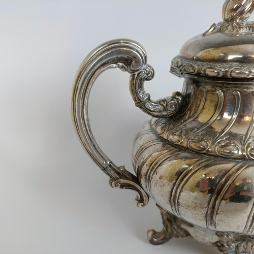 116 - A Continental silver coloured metal teapot, and a matching cream jug, stamped .800 (2)