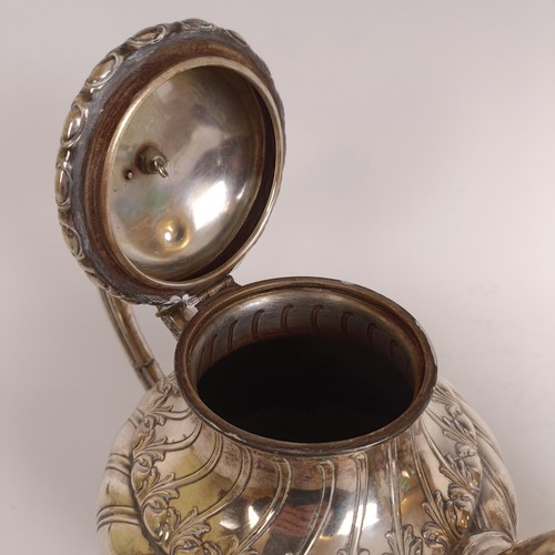 116 - A Continental silver coloured metal teapot, and a matching cream jug, stamped .800 (2)