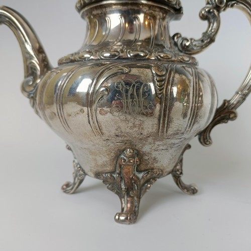 116 - A Continental silver coloured metal teapot, and a matching cream jug, stamped .800 (2)