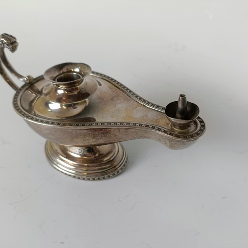 142 - A silver table top cigar lighter, in the form of an oil lamp