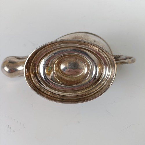 142 - A silver table top cigar lighter, in the form of an oil lamp