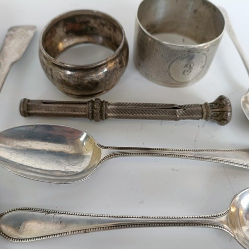 147 - Assorted silver spoons, napkin ring, and a pencil inset with a purple stone, 6.1 ozt, (all in)