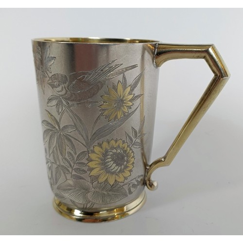 149 - A Victorian silver mug, engraved birds and foliage, London 1884