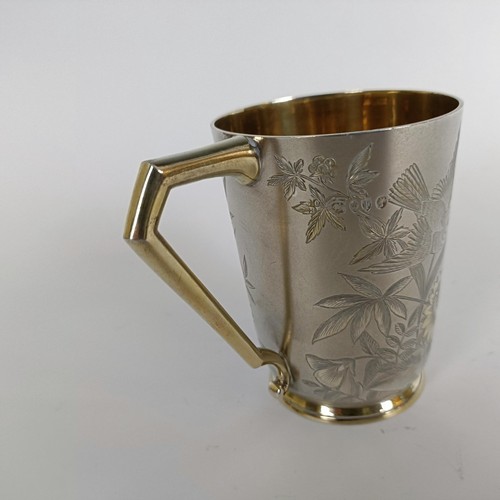 149 - A Victorian silver mug, engraved birds and foliage, London 1884