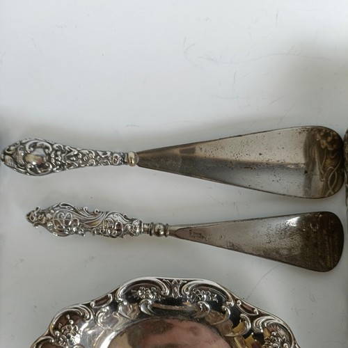 151 - Two matching pairs of silver handled button hooks and shoehorns, other Art Nouveau brushes and a sil... 