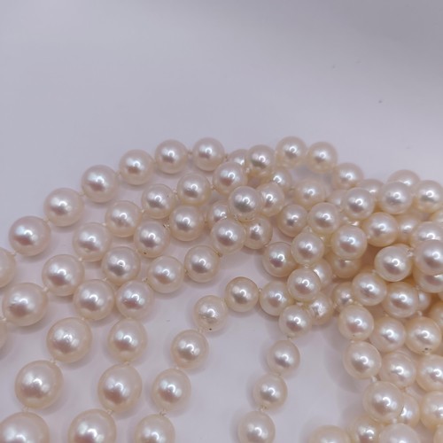 301 - A four strand cultured pearl necklace, with an impressive diamond clasp, the largest diamond approx.... 