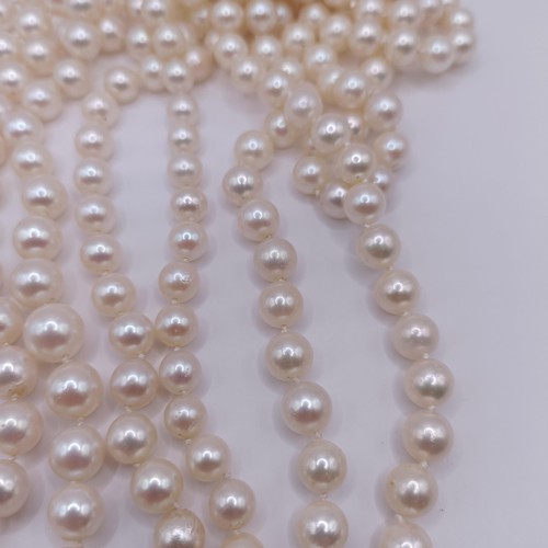 301 - A four strand cultured pearl necklace, with an impressive diamond clasp, the largest diamond approx.... 