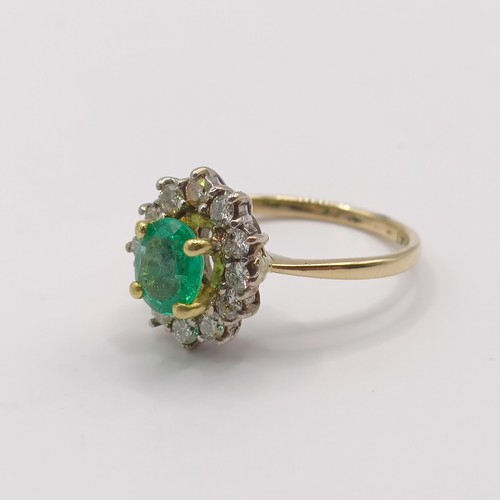 304 - An 18ct gold, emerald and diamond ring, ring size H