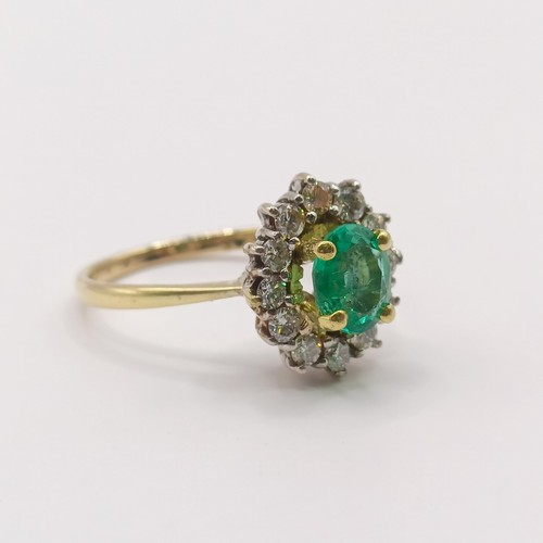 304 - An 18ct gold, emerald and diamond ring, ring size H