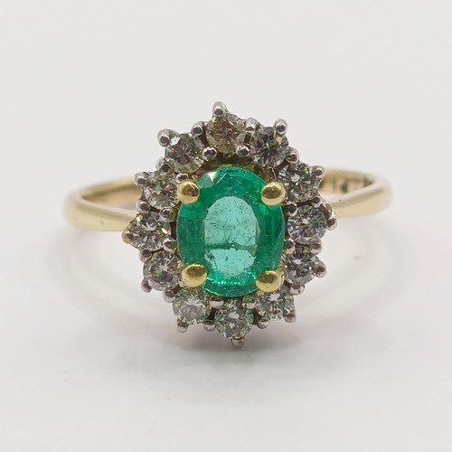 304 - An 18ct gold, emerald and diamond ring, ring size H