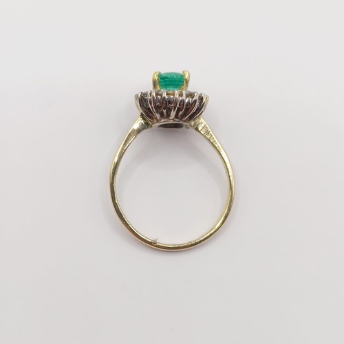 304 - An 18ct gold, emerald and diamond ring, ring size H