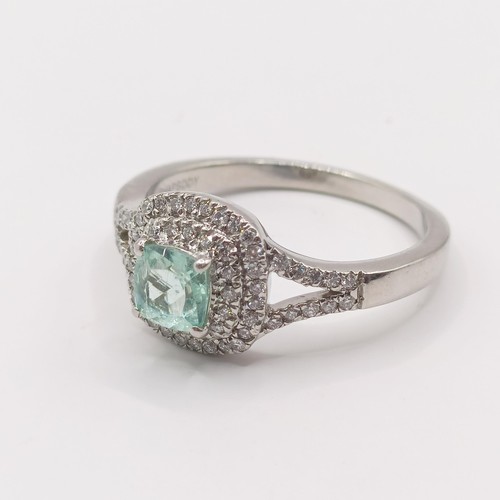 305 - A platinum, aquamarine and diamond rhapsody ring, ring size T