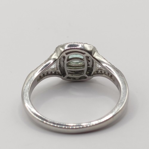 305 - A platinum, aquamarine and diamond rhapsody ring, ring size T