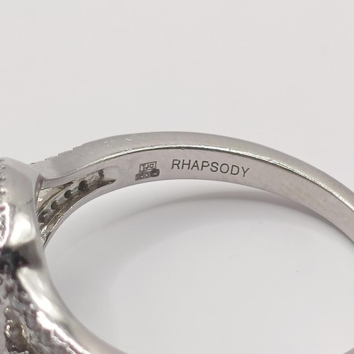 305 - A platinum, aquamarine and diamond rhapsody ring, ring size T