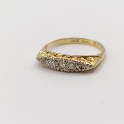 306 - An 18ct gold and diamond ring, ring size K