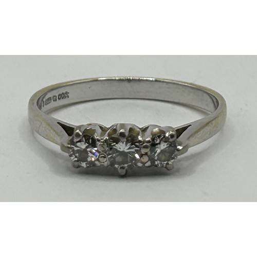 307 - An 18ct white gold and three stone diamond ring, ring size P