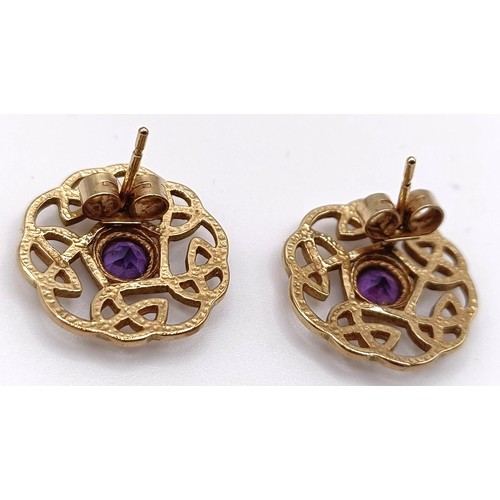 309 - A pair of 9ct gold and amethyst Celtic style stud earrings