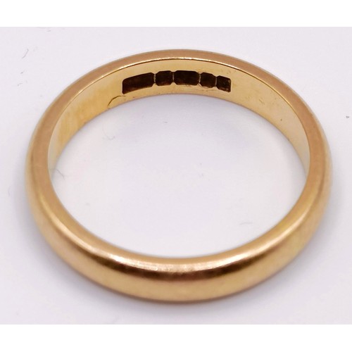 310 - A 22ct gold wedding band, ring size K, 4 g