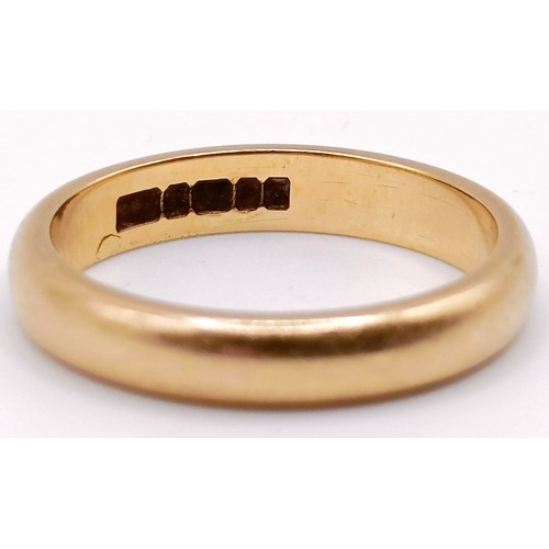 310 - A 22ct gold wedding band, ring size K, 4 g