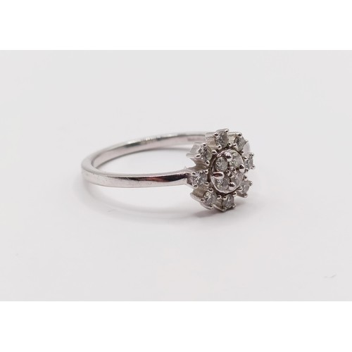 311 - A platinum and diamond snowflake cluster ring, ring size N...