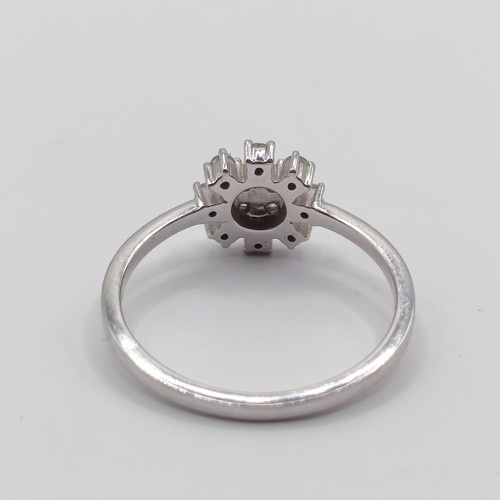 311 - A platinum and diamond snowflake cluster ring, ring size N...