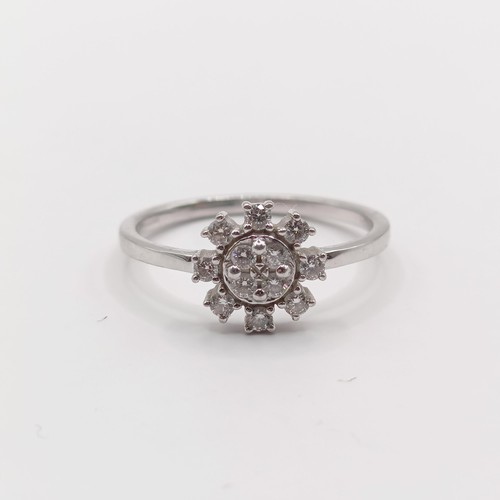 311 - A platinum and diamond snowflake cluster ring, ring size N...