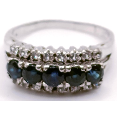 312 - A 14ct gold and blue hardstone ring, ring size P, and a silver and blue and white stone ring, ring s... 