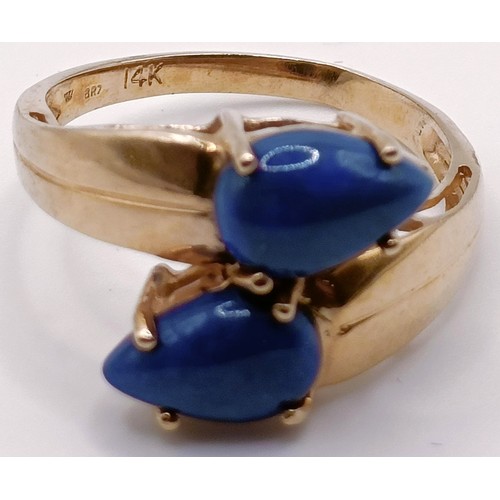 312 - A 14ct gold and blue hardstone ring, ring size P, and a silver and blue and white stone ring, ring s... 