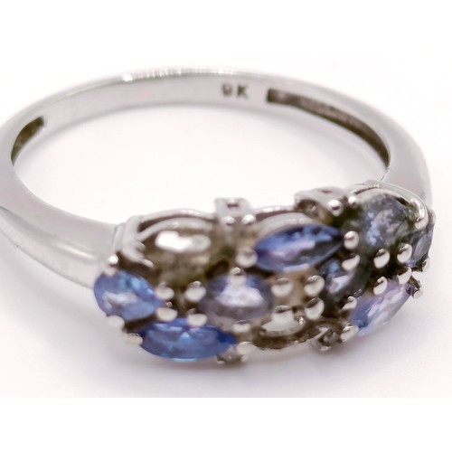 313 - A 9ct gold and diamond chip ring, ring size L, and a 9ct white gold, blue and white stone ring, ring... 