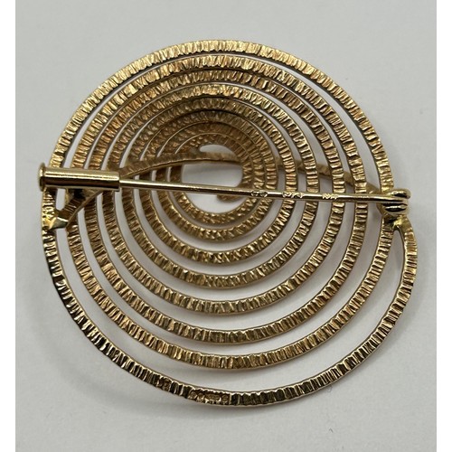 317 - A 20th century 9ct gold spiral brooch...