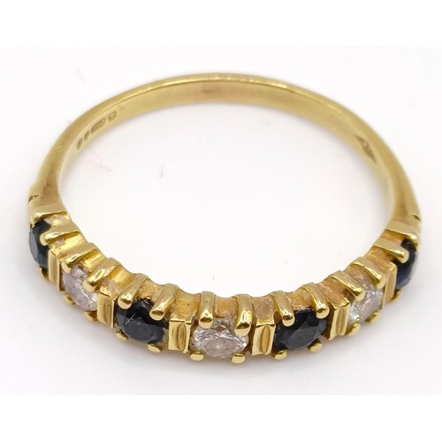 323 - An 18ct gold, sapphire and diamond half hoop ring, ring size Q...