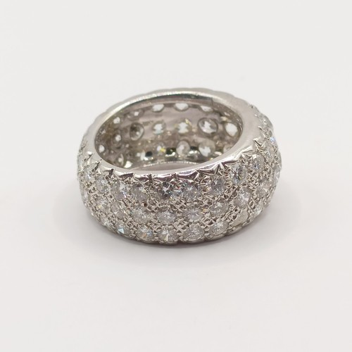 331 - An 18ct white gold and pave set diamond eternity ring, ring size O