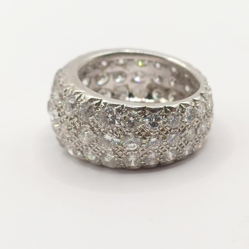 331 - An 18ct white gold and pave set diamond eternity ring, ring size O