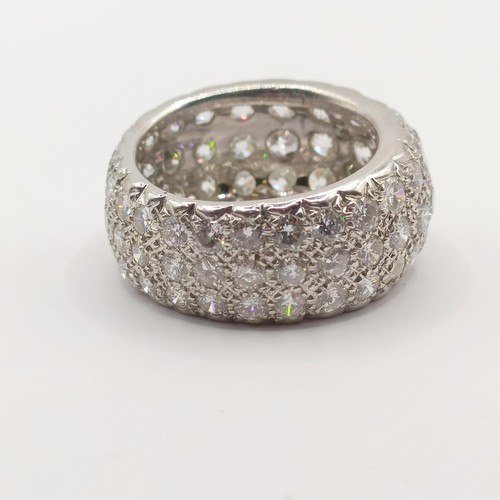 331 - An 18ct white gold and pave set diamond eternity ring, ring size O