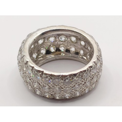 331 - An 18ct white gold and pave set diamond eternity ring, ring size O