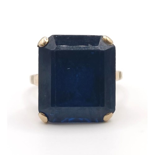 332 - A 9ct gold and blue stone dress ring...