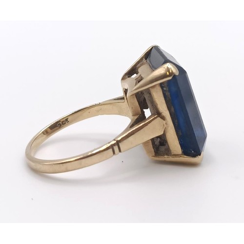 332 - A 9ct gold and blue stone dress ring...